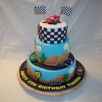 Cars Cake Choc/Vanilla cake for a boys birthday. Fondant with fondant accents, cars were bought. Thanks so much to all who have made these before and...
