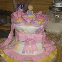Ballet Tutu And Slippers wasc cake with alternating raspberry and strawberry filling vanilla butter cream icing with satin ice fondant, ruffles, shoes, figurine and...