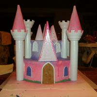 My First Castle Cake I made this cake for my daughters 1st birthday. I used the Wiltons Castle Cake kit. 2 10" round cakse for the base, and 2 6"...