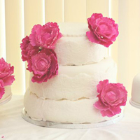 Three Tiered Lace And Peonies Three tiered vanilla cake with peach and strawberry cream cheese mousse filling. Covered in fonant. Size 8, 10, 12, adn two 12 side ones....