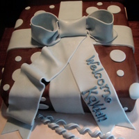Baby Shower Gift Box Covered in chocolate fondant with fondant bow and polka dots.