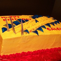 Wolverine Blades and blue pieces cut out of fondant and painted. I dragged a dowel rod thru the cake to look like the blades had torn it.