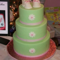 Dummy Cake Dummy cake for a children's boutique. Covered in fondant with fondant baby booties and daisies.