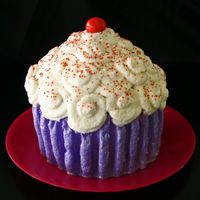 Giant Cupcake Wilton giant cupcake pan. Buttercream frosting and gumpaste cherry. Red pearl dust mixed with vodka for the effect on the cherry.