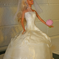 Bridal Doll This cake was made to replicate the bride and her dress. Fondant with an additional layer covered in edible sparkles.
