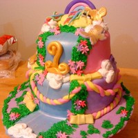 My Little Pony , Fairy Tale First Birthday Father designed this - this is the colors he wanted its a 9in and 8in tiered , all fondant all edoble - my first fondant figure - I am not...