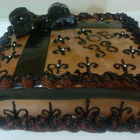 Masculan Chocolate Gourmet Cake death by chocolate cake , fondant/gumpaste bow , deleflor design , simple , chcoc cake , choco mousse, milk and fudge buttercream , silver...