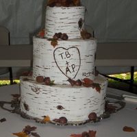 Birch Logs And Fall Leaves triple stacked birch logs with chocolate walnuts,acorns, other nuts, and edible rice paper fall leaves scattered on layers Cake was 3...