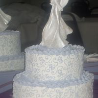 Two Hearts Joined stacked oval layers with lavender hearts and swirls pattern replicated from toppers bridal gown. Cake was made for a couple who had planned...
