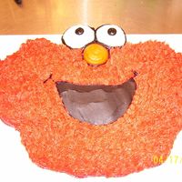Elmo 24 cupcakes with bc. i made all the elmo fur with the grass tip #233