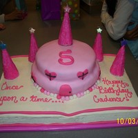 Storybook Castle for my daughter's 5th birthday. wasc for the "book" and strawberry cake for the 9" and 6" rounds. used sugar cones...