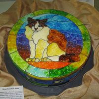 Stained Glass Kitty This is one of my most favorite cakes! It is a 14 inch dummy covered in fondant then I did an image transfer with piping gel off of a...