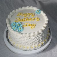 Dsc06838.jpg This is my first basketweave cake that I made for my father. I used a buttercream frosting with royal icing flowers. I used white so that...