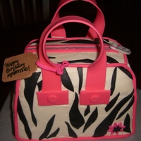 Zebra Purse Cake zebra purse cake for a 9 year old's birthday. Tried to copy the BEAUTIFUL one done by supakiki- did not do it justice, but the...