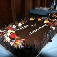 Anniversarycake.jpg Orange sponge cake, filled with Grand Marnier ganache. Coated in ganache and decorated with frsh fruit. My Parents 25th.