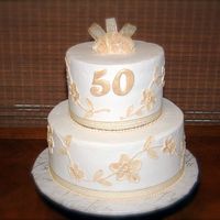 Dscf0028.jpg 50th anniversary cake for a friend's parents. This was my first attempt at brush embroidery. All BC with MMF roses and 50. I...