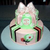 Dscf0013.jpg Cake design made to match the baby's room decor. All BC with fondant accents and a gum paste bow highlighted with pearl dust.This was...