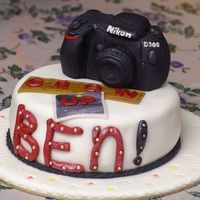 Camera Cake A cake requested for a freelance photographer. The camera is made from fondant and gumpaste.
