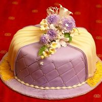 A Purple Engagement Cake The flowers are store bought. The yellow fringe is done with a 'clay extruder'. The board covering with a textured roller. For...
