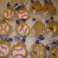 Baseball And Mitt Sugar Cookies These cookies were made for my daughters t-ball team. Each bag contained a baseball and mitt cookie.