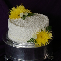 Elegant Birthday Cake With Fresh Flowers 10 in round cake, buttercream icing. White cake, lemon filling. Fresh flowers.