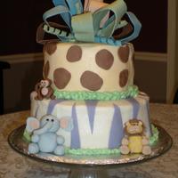 Pastel Baby Safari Cake Buttercream with fondant accents.