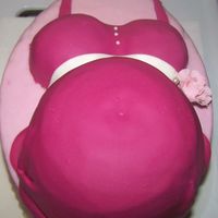Belly Cake Oval with half ball pan "belly". Iced in buttercream, covered in Marshmallow Fondant.