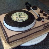 Record Player b/c 9x13 cake with 8 in round on top. "record" is fondant, knobs are chocolate candy and "arm" is real, from an old...
