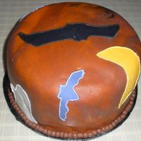 Halloween Had a lot of trouble with this one. Started out with chocolate fondant and ended up using another class mates orange. Marbled them together...