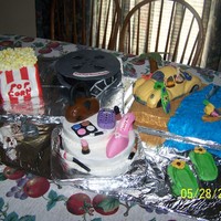 Mixture Of Things Liked Birthday cakes for my two nieces...they wanted a combination of things they like...Popcorn and reel..were Strawberry cake covered in...