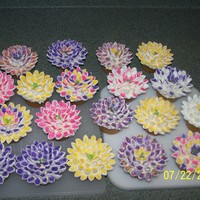 Cupcake Flowers Saw these youtube and had to make them...Butterscotch cupcakes, frosted with buttercream...flowers are mini marshmallows cut diagonally and...