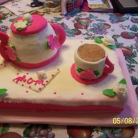 Mothers Day Cake This cake was for my mom for Mothers Day... she loves her coffee so I carved a Strawberry Cake for the teapot and baked a cake in a coffee...