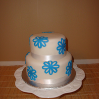 Blue Flowers A 10 and 8 inch fondant covered cake with blue fondant flowers.
