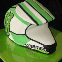 Dirtbike Helmet Carved from a 10" and 2 8" cakes. The visor is fondant covered cardboard.