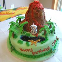 Dino-Topia I made this for my son's 3rd birthday last weekend! It was a big hit! The volcano had candles at the top to make it light up!!