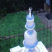 Wedding Cake This is my first wedding cake. I made it for my brother's wedding.It's sitting on the floating tier cake stand. I used BC icing....