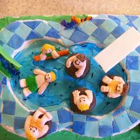 Birthday At The Water Park Cake made to look like a pool with a waterslide and diving board, made out of gumpaste. The kids were piped out of buttercream on to little...