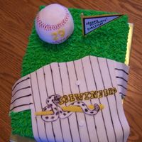 Sidewinders Baseball Cake decorated in buttercream to look like grass. Jersey made out of fondant. Baseball formed out of Rice Krispies and covered in fondant...