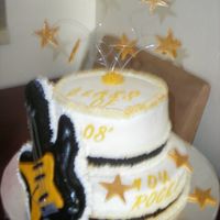 Graduation Cake Buttercream and the guitar is rice crispies and fondant.