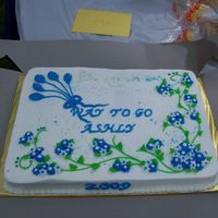 Ashly's 8Th Grade Graduation Cake 2 9X13 cakes side by side. One yellow WASC, the other Chocolate Carmal WASC cake. Torted and filled with Itialian cream icing. Iced in...