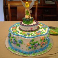Tinkerbelle First Birthday Cake I made this cake for my cousin's daughter's first birthday. It was chocolate cake with Italian Cream filling and vanilla...