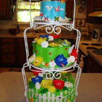 Garden Party Baby Shower My cousin wanted a very bright baby shower cakes. No pastels. The bottom is Chocolate Carmel Cake, vanilla buttercream filling. The top two...