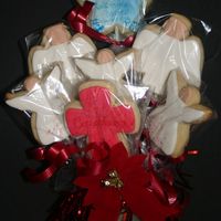 Christian Sugar Cookie Bouquet My first attempt at sugar cookies. These were made as Christmas gifts. Assortment of angels, a cross and a star. The star has a scripture...