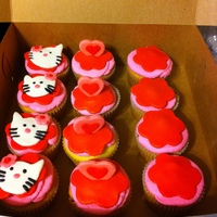 Hello Kitty Cupcakes Cupcakes to topper cake, all hand cut and decorated...buttercream and MMF