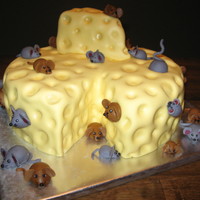 The Mice And The Cheese Three layer 12" cake with 30 fondant mice. This was for a 30th birthday party that was canceled last minute because of sick kids.