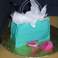 Tiffany Shopping Bag And Shoe Purse is cake with fondant covering. Shoe is gum paste.