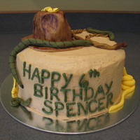 Indiana Jones Buttercream with fondant accents. Hat is a piece of WASC sculpted and covered with fondant and painted with cocoa. The whip is also fondant...