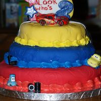 Cars Birthday Cake For 2 Year Old White cake, BC frosting underneath, covered in fondant. I used a Wilton fondant mat to get the star imprents. Checkered flag was much...