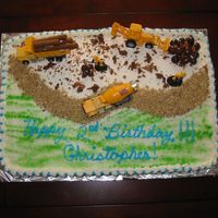 Truck Bday Cake Little Boy The road is made of crush up shredded wheat and the rocks are bridge mixI made this for my grandsons 2nd birthday. He loved it!