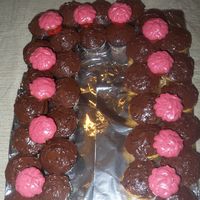 Rose Garland yellow and chocolate cupcakes with BC and triple choc chip icing. For the Derby and a birthday at the party we had.